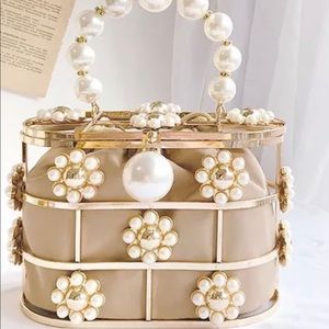 Beaded pearl metallic clutch.